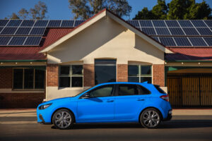 Hyundai i30 blue or a heavily edited image of a car in front of the Boyanup Tavern.